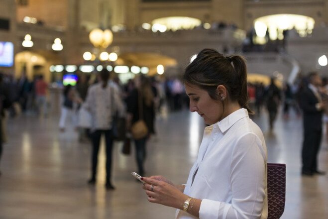 woman-looking-at-her-phone-at-grand-central-station-in-new-york---roy3775-2-5.jpg