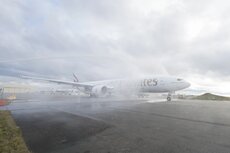 A6-EPQ receives a ceremonial water cannon salute on its departure from Paine Field, Everett, Seattle.jpg