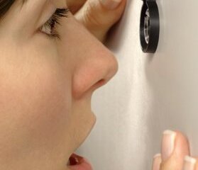 Peephole scene. Женщина смотрит в глазок. Look through peephole. Door peephole. Look through peephole.