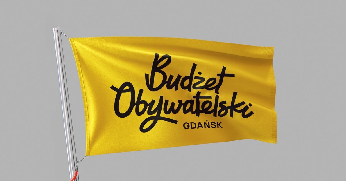 Zdjęcie przedstawia żółty proporzec/flagę. Na tym czarny napis Budżet Obywatelski. 