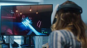 Woman playing virtual reality game web